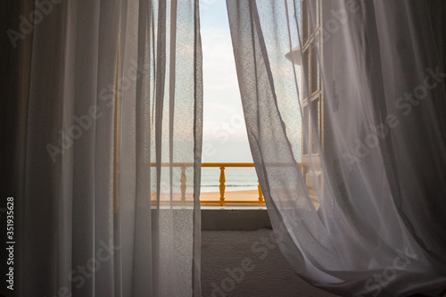 View of Nazare beach from the window of a house on the promenade
