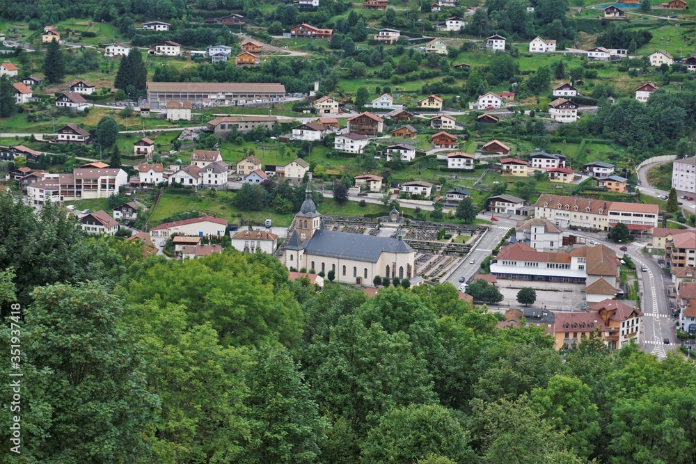 Close-up view over La Bresse with focus on the church and cemetery