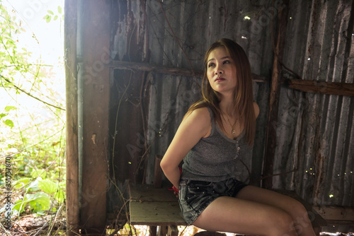 Canvas Print Woman hostage tied by rope in cabin