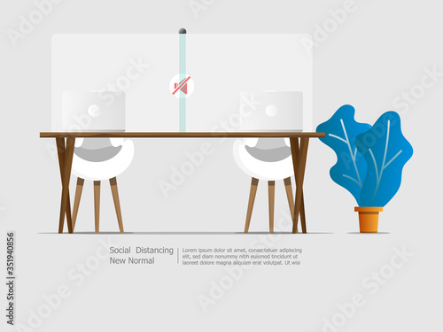 laptop on desk with partition social distancing