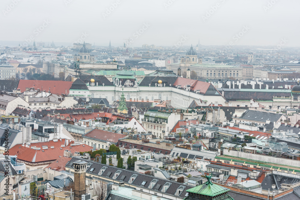 Cityscape of the old town of Vienna in a heavy snowy day.  View at the tower of St. Stephen's Cathedral in Vienna, Austria.
