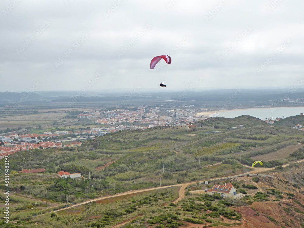 Paragliders flying at Gralha, Portugal Paragliders flying at Gralha, Portugal