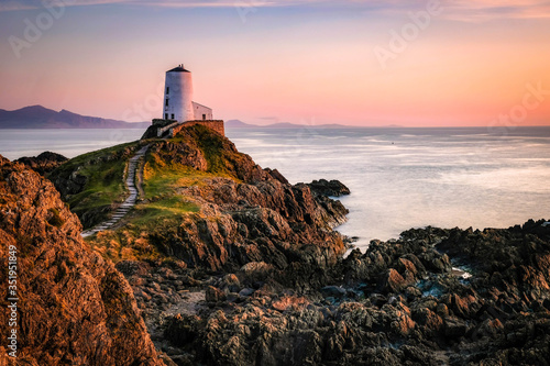 Tŵr Mawr Lighthouse, Llanddwyn Island, Anglesey in the dramatic landscapes of scenic Wales, fantastic adventure travel destination or holiday vacation to view picturesque scenery at sunrise or sunset