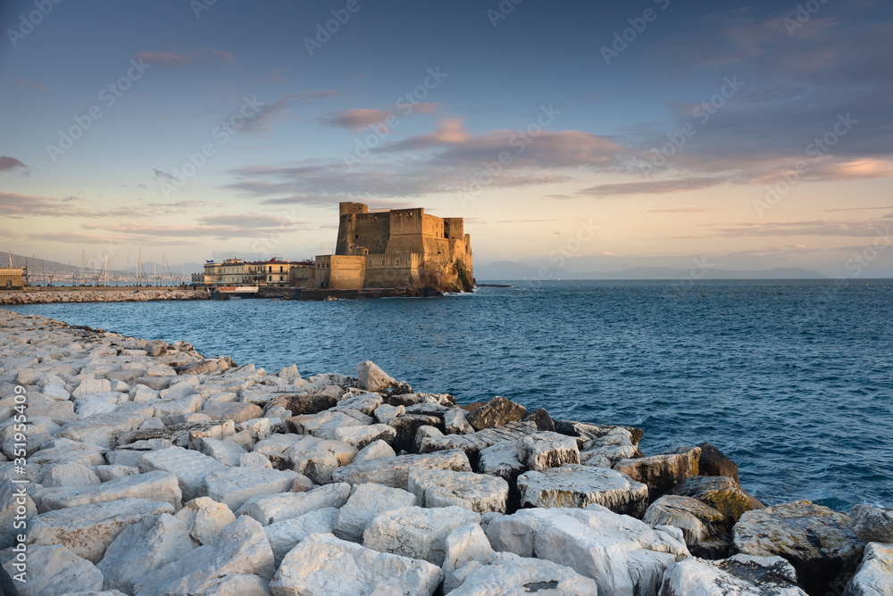 Castel dell'Ovo, Naples. One of the most famous places in Naples illuminated by the setting sun.