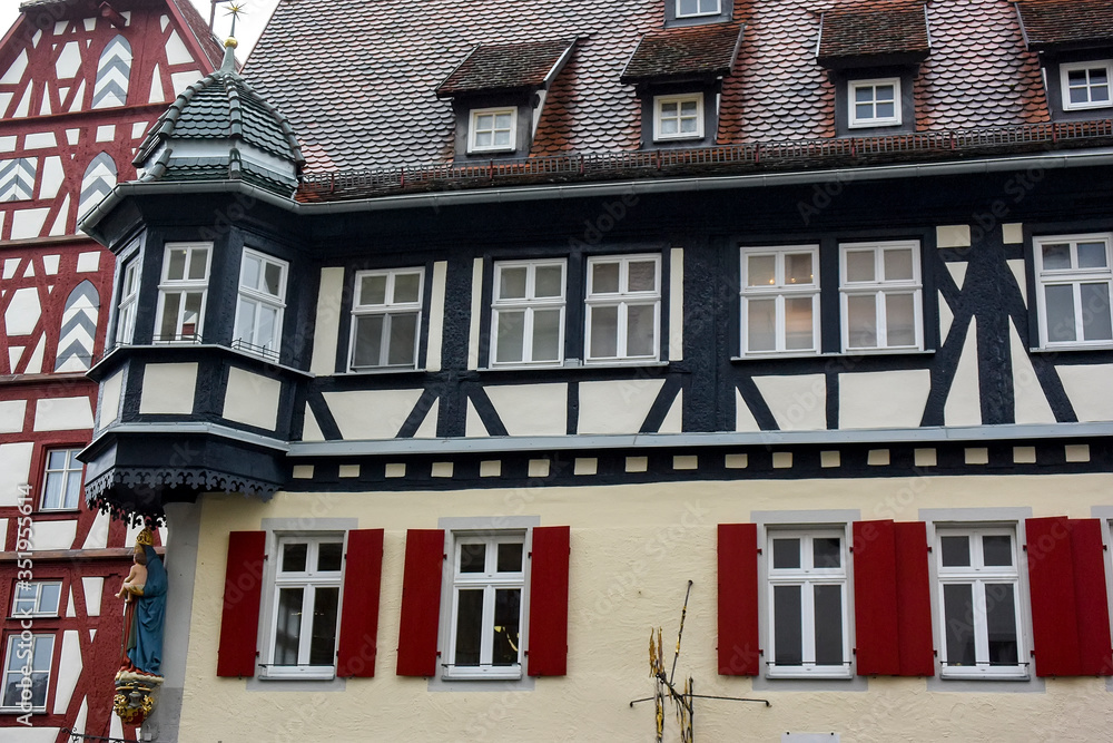 Traditional half-timbered houses on narrow medieval street in Rothenburg ob der Tauber, Bavaria, Germany. November 2014 Traditional half-timbered houses on narrow medieval street in Rothenburg ob der Tauber, Bavaria, Germany. November 2014