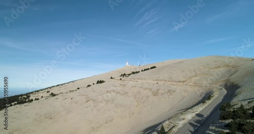 Car drives down road on Mont Ventoux, France in epic landscape