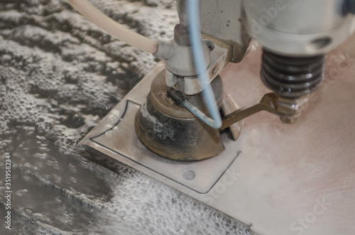 Water jet machine at work Cnc water jet machine photo