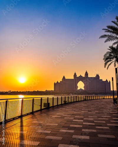 DUBAI / UNITED ARAB EMIRATES - MAY 2020: The multi-million dollar Atlantis resort in Palm Jumeirah during golden hour. The beautiful Atlantis hotel with a fiery orange sky in the background.  © Ashton Joel Misquith