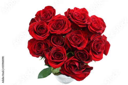 fresh red roses in a bouquet isolated on white background