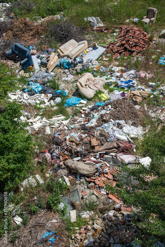Novi Sad, Serbia - May 23, 2020: Landfill in the city center. People throw old things and garbage everywhere