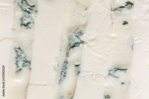A mixture of gorgonzola cheeses with mascarpone macro. Light background eating dairy product.