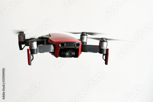 Fototapeta Naklejka Na Ścianę i Meble -  Drone Flying Against Wall At Home or inside building