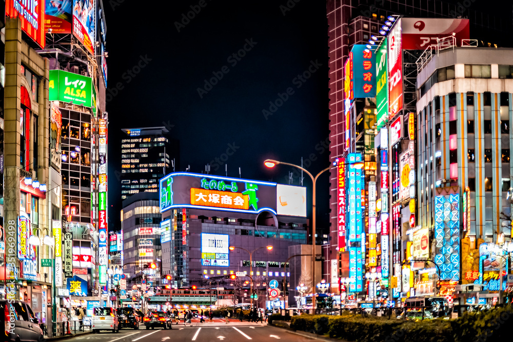 Tokyo, Japan - April 3, 2019: Yasukuni-dori avenue with cars people by