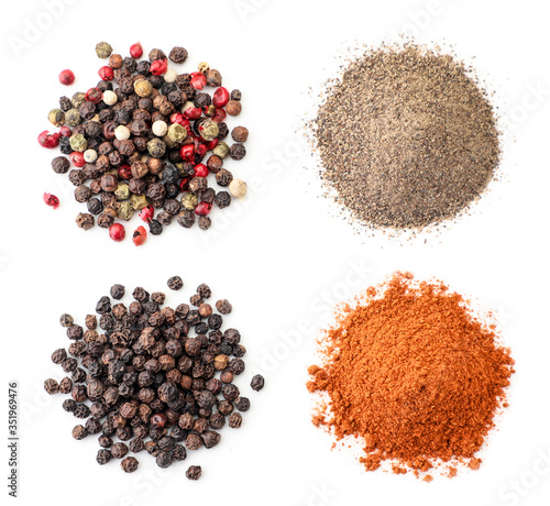 Fototapeta Naklejka Na Ścianę i Meble -  Heap of peppercorns and ground pepper on a white background, isolated. The view from top