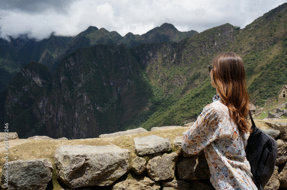 Traveller on the top of the mountain. Machu Picchu, Peru