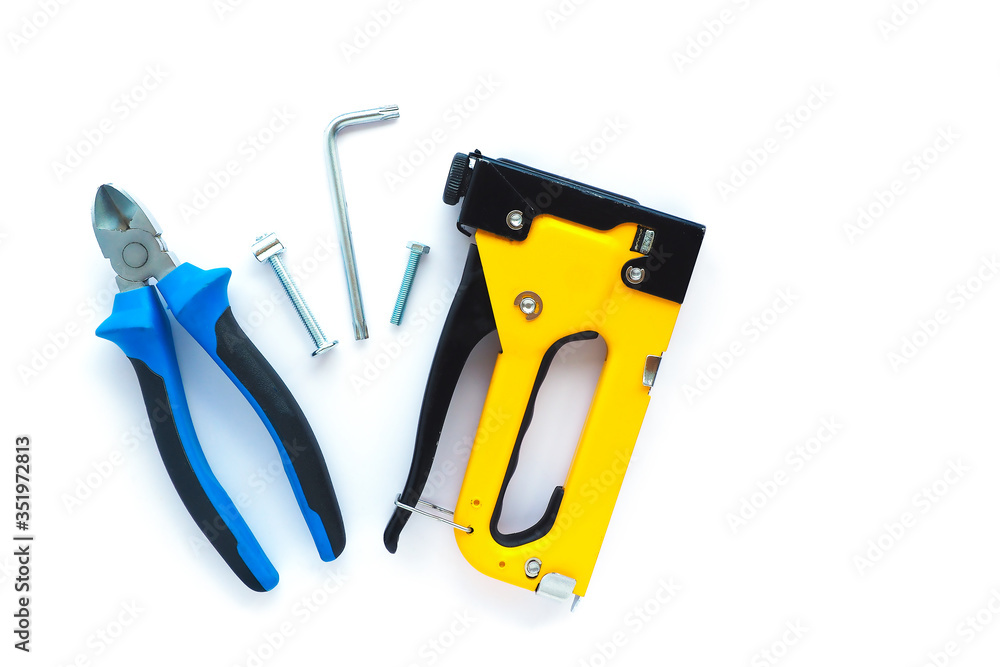 .fasteners and repair tools on a white background. flat layout, top view. Space for text.. .fasteners and repair tools on a white background. flat layout, top view. Space for text..