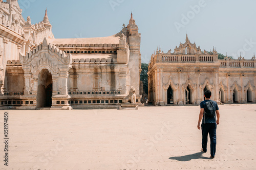 Tourist walking around the Ananda Temple, Bagan, Mynmar, Burma photo