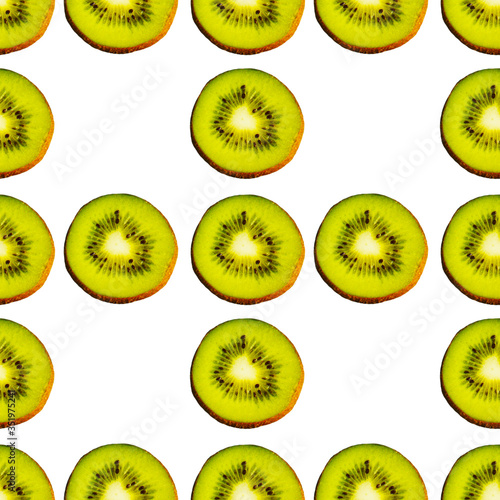 Seamless endless pattern of juicy green slices of kiwi fruit isolated on white background. Design for wrapping paper, fabric and wallpaper.