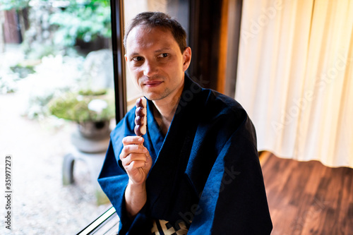 Canvas Print Traditional japanese room in house or ryokan restaurant with man in kimono or yu