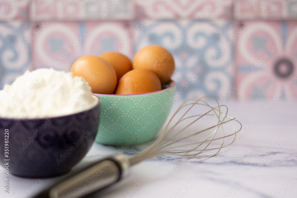 Kitchen utensils for cooking, eggs and flour in bowl Kitchen utensils for cooking, eggs and flour in bowl
