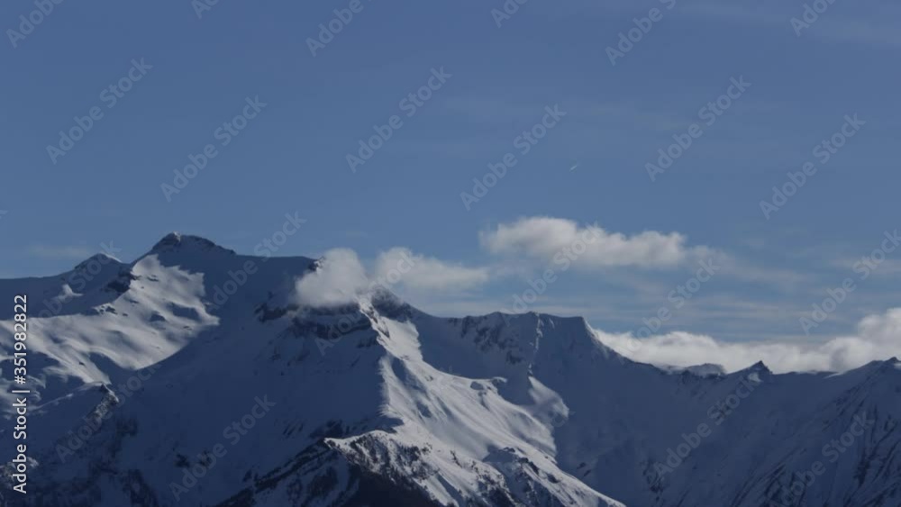 timelapse of clouds passing over snowy mountains timelapse of clouds passing over snowy mountains