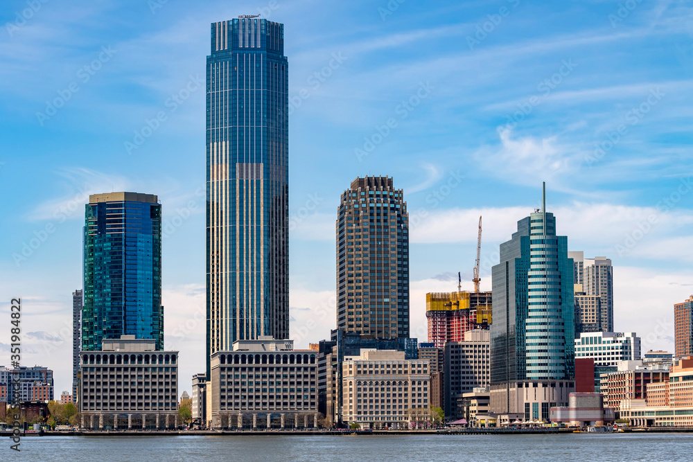 Jersey City skyline with skyscrapers over Hudson River viewed from New York City Manhattan downtown