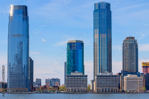 Jersey City skyline with skyscrapers over Hudson River viewed from New York City Manhattan downtown