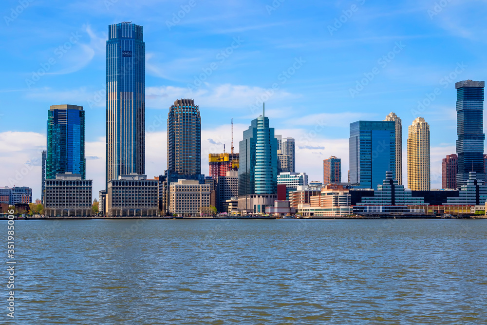 Jersey City skyline with skyscrapers over Hudson River viewed from New York City Manhattan downtown