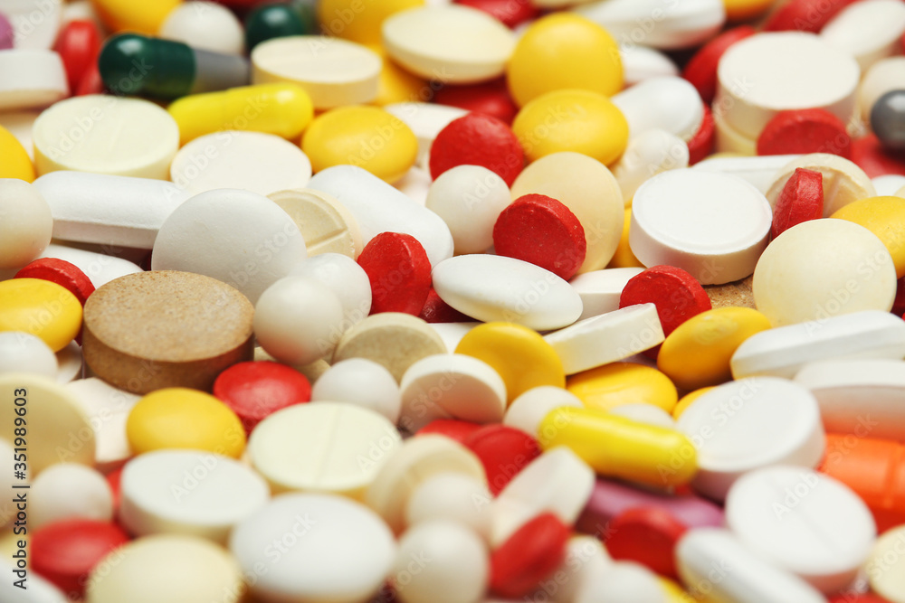 Different colorful tablets at white background Different colorful tablets at white background