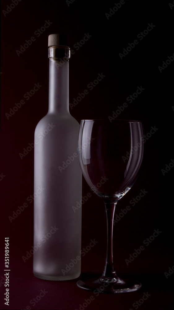 Wine glasses on black backround and wine bottles Wine glasses on black backround and wine bottles