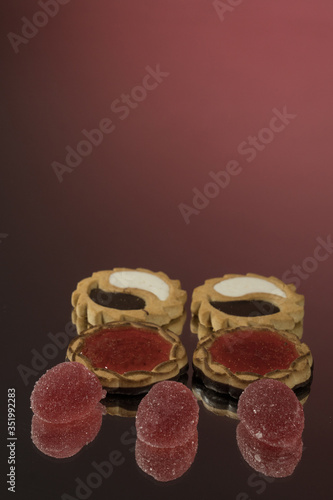 Several marmalade sweets isolated on a red background