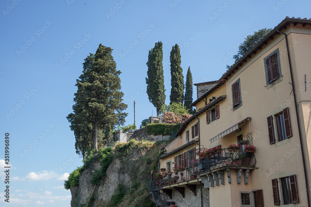 View of balconies full of flowers in Barga, Tuscany, Italy.