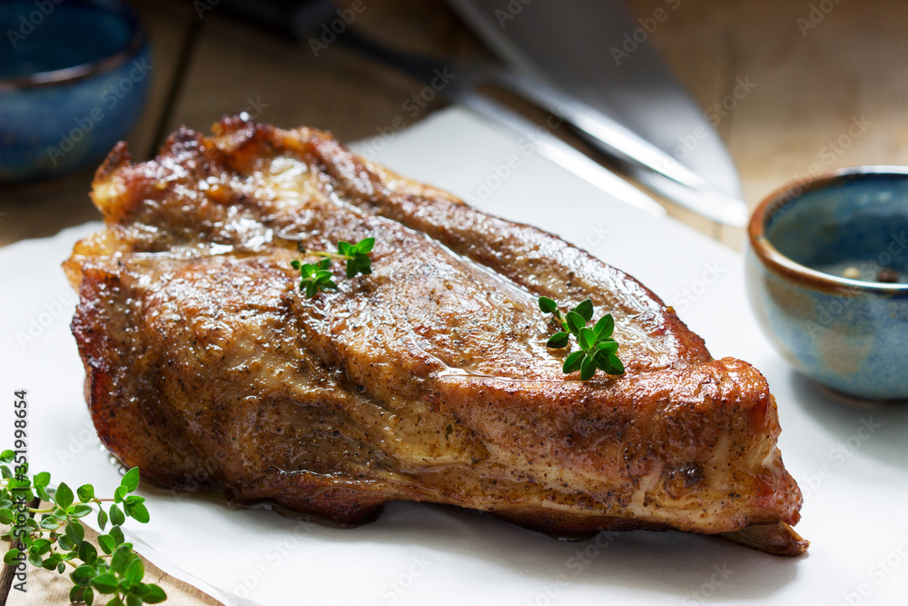 Baked pork shoulder on the bone with spices, herbs and aromatic oil. Baked pork shoulder on the bone with spices, herbs and aromatic oil.