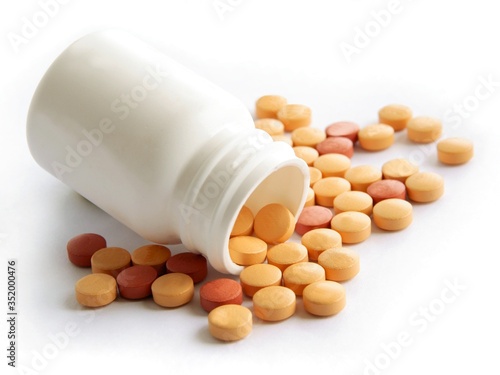 multicolor various pills and capsules as medicines photo