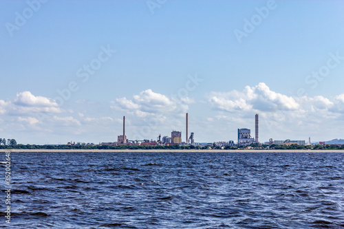 Industrial towers in Guaiba city and Guaiba lake
