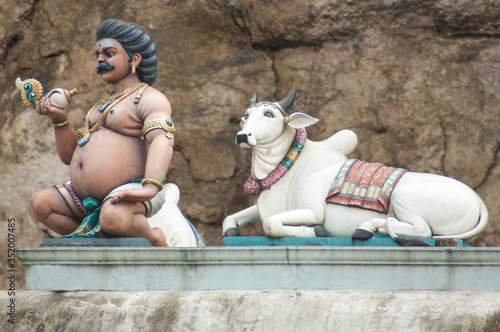 Statue of a cow and the herder in Malaysia