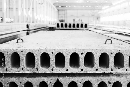 Stack of precast reinforced concrete slabs in factory workshop