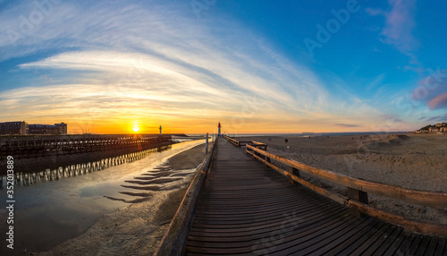 Wooden Pier and Lighthouse