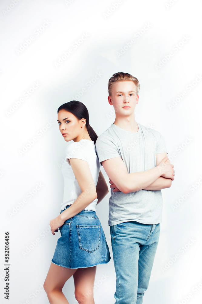 modern hipster guys together couple diverse nations, asian girl and caucasian blond boy isolated on white background, lifestyle people concept modern hipster guys together couple diverse nations, asian girl and caucasian blond boy isolated on white background, lifestyle people concept