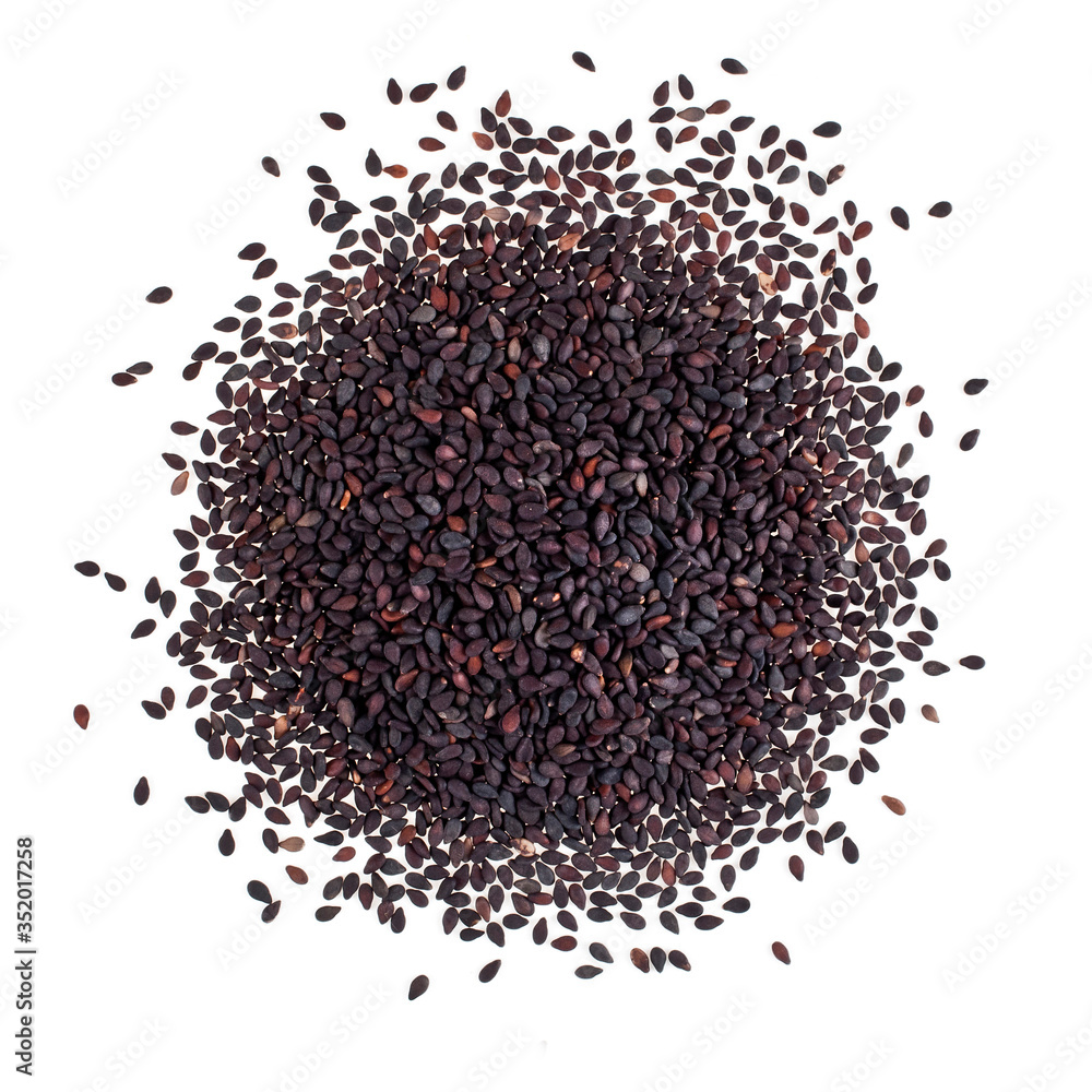 Heap of black sesame seeds isolated on a white background. Top view. Heap of black sesame seeds isolated on a white background. Top view.
