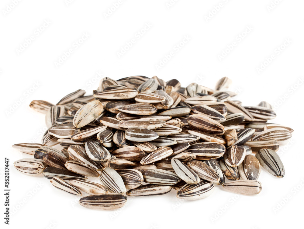 Heap of sunflower seeds isolated on a white background. Heap of sunflower seeds isolated on a white background.