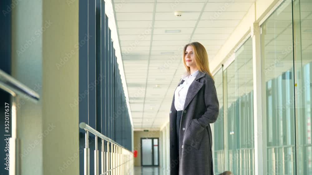 Businesswoman with his luggage while waiting for the plane in airport. End of quarantine Businesswoman with his luggage while waiting for the plane in airport. End of quarantine