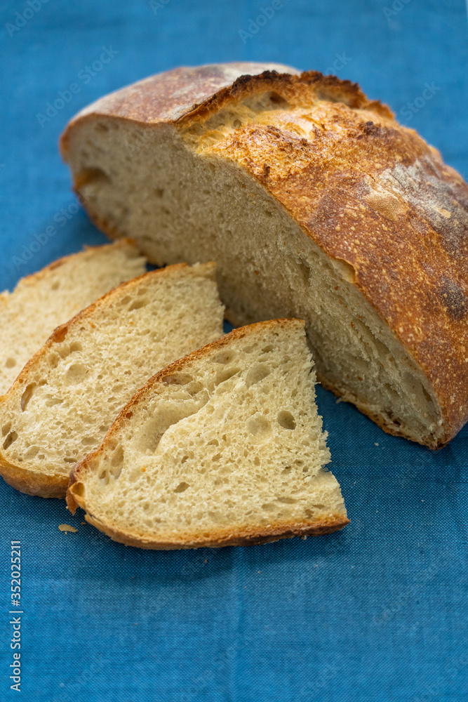 Sliced boule (round loaf) of freshly baked sourdough bread Sliced boule (round loaf) of freshly baked sourdough bread