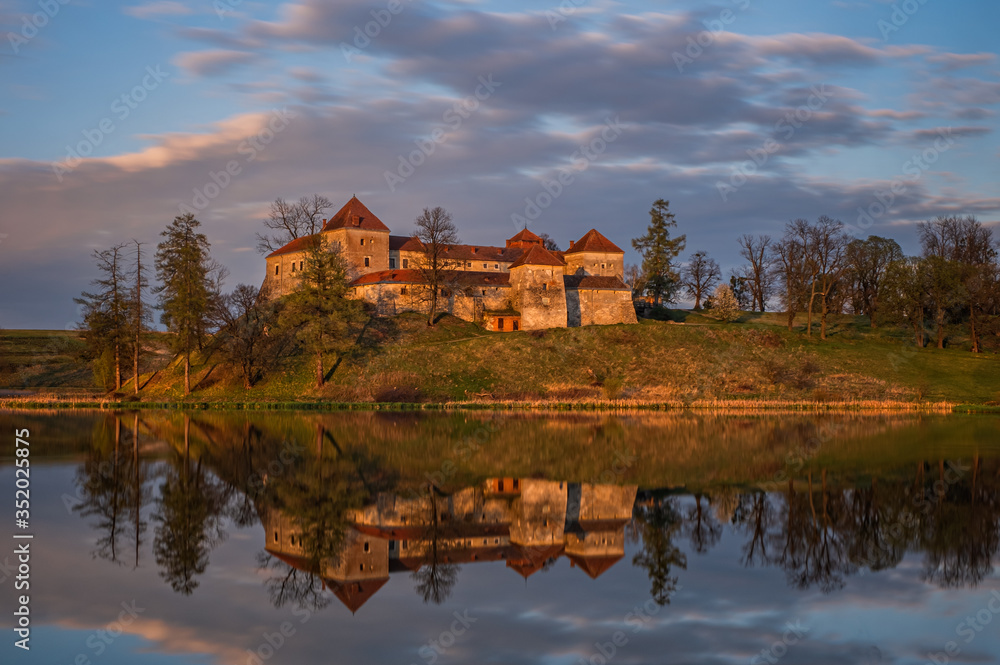 Ancient Svirzh castle at sunset in april 2020. Svirzh village, Lviv region.