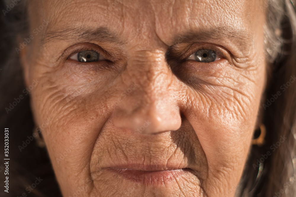 Senior woman with blue eye's looking at the camera Senior woman with blue eye's looking at the camera
