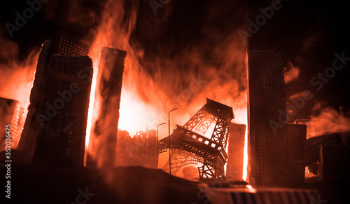 Photography Empty street of burnt up city, flames on the ground and blasts with smoke in the distance