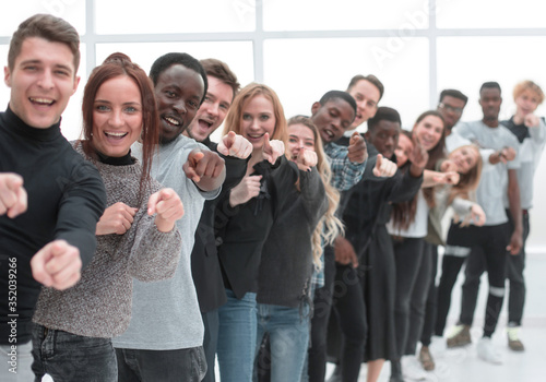 close-up . team of happy young people pointing at you