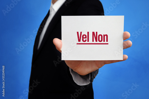 Vel Non. Lawyer holding a card in his hand. Text on the board presents term. Blue background. Law, justice, judgement photo