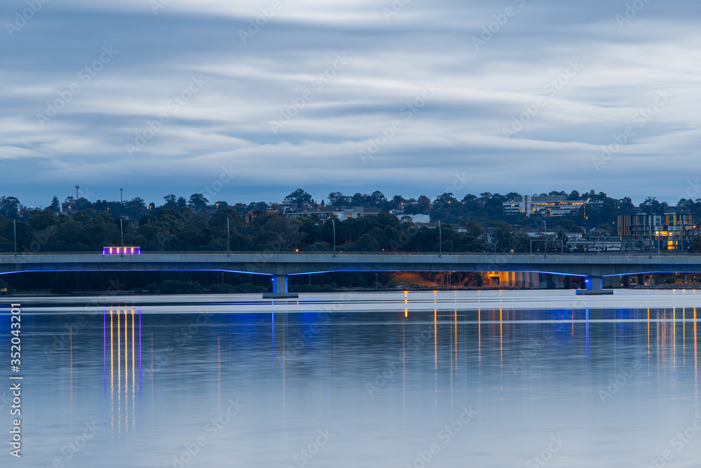 Bridge with blue light underneath at Homebush Bay, Sydney, Australia.