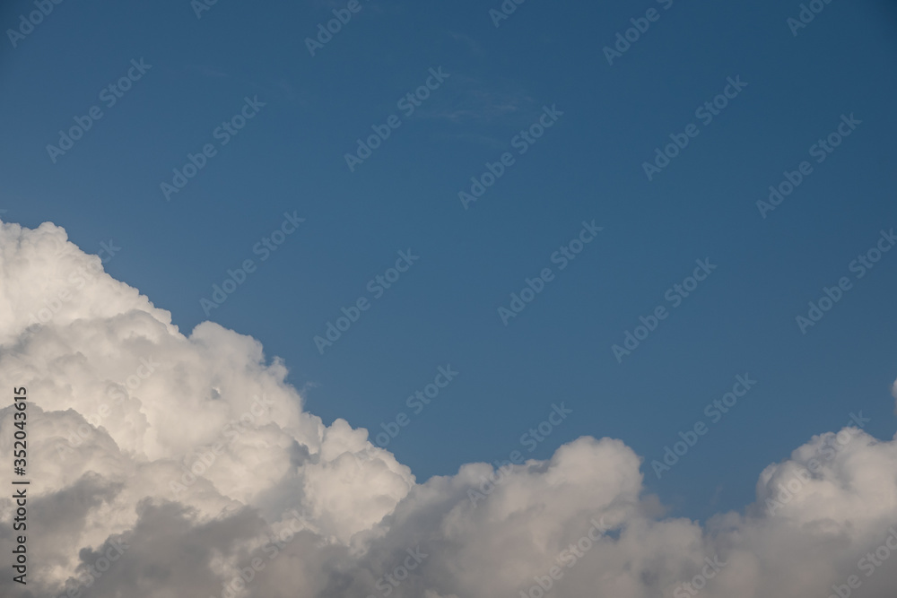 Sunny cloudscape blue sky with white cumulus clouds cloudscape. Beautiful nature background backdrop sky. - obrazy, fototapety, plakaty 
